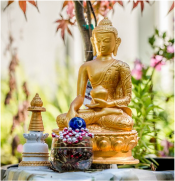 Shakyamuni Buddha with offerings, Kachoe Dechen Ling, California, USA. Photo by Chris Majors.